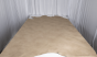 Picture of multitone light grey pigmented upholstery leather displayed on a table