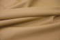Close up of a warm tan pigmented upholstery leather