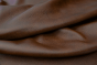 Closeup picture of Vintage Sienna soft, rich multi tone brown colored upholstery leather for furniture.