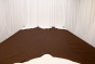 Picture of Vintage Sienna, rich brown semi-aniline leather hide for upholstery displayed on a table