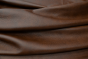 Closeup picture of Vintage Sienna, rich brown leather for sofas, chairs, and other furniture upholstery.