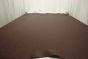 Picture of warm spice brown pigmented upholstery leather displayed on a table
