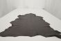 Picture of Lambskin Anthracite, dark grey colored leather hide for upholstery displayed on a table.