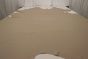 Picture of rich taupe leather hide for upholstery displayed on a table
