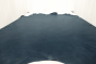 Picture of deep blue upholstery leather hide laying flat on a table