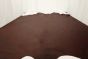 Multitone chocolate Italian upholstery leather hide displayed on a table