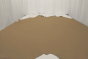 Picture of warm dark sand color pigmented leather displayed on a table