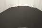 Picture of a charcoal grey Italian upholstery leather displayed on a table