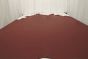 Picture of rich dark red pigmented leather for upholstery displayed on a table