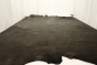 Picture of dark brown aniline upholstery leather displayed on a table