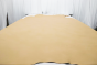 Picture of buttercream color pigmented upholstery leather displayed on a table