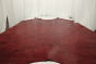 Picture of rich bright red pull up leather displayed on a table
