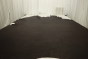 Rich dark brown top grain upholstery leather displayed on a table