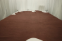 Picture of rich saddle brown top grain upholstery leather displayed on a table