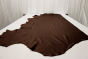 Chocolate espresso multi-tone genuine leather laying flat on a table