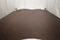 Picture of Mile's coffee brown semi-aniline leather hide for upholstery displayed on a table