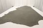Multi-tone grey genuine cowhide leather laying flat on a table