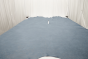 Picture of Rhapsody, light blue semi-aniline leather hide for upholstery displayed on a table