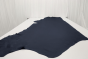 Deep blue colored natural grain leather laying flat on a table