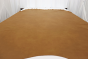 Picture of Autumn Leaves, cognac semi-aniline leather hide for upholstery displayed on a table
