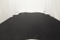 Picture of Midnight Train, dark grey semi-aniline leather hide for upholstery displayed on a table