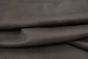 Close-up picture of Lambskin Anthracite, rich dark grey genuine leather for chairs, sofas and other furniture upholstery. 