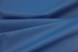 Close up picture of dark electric blue smooth Italian leather for upholstery