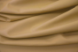 Close up of a warm tan pigmented upholstery leather