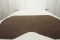 Genuine walnut brown leather suede displayed on a table 