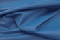 Close up picture of dark electric blue smooth Italian leather for upholstery