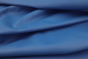 Close up picture of dark electric blue smooth Italian leather for upholstery