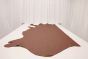 Amaretto brown colored leather material laying flat on a table 
