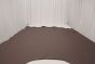 Chocolate brown colored leather material laying flat on a table 