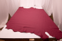 Picture of raspberry pink full grain upholstery leather displayed on a table