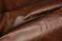 Close up of saddle brown distress upholstery leather