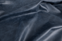 Close up of navy blue aniline dyed upholstery leather