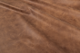 Close up of rich brown multitone distress upholstery leather