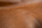 Close up picture of multitone cognac brown Italian upholstery leather
