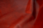 Close up of multitone red semi aniline upholstery leather