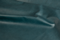 Close up picture of deep teal full grain upholstery leather