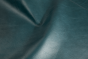 Close up picture of deep teal full grain upholstery leather