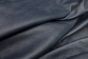Close up picture of dark blue distressed leather for upholstery