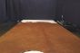 Picture of Bourbon Distress full grain leather hide for upholstery displayed on a table