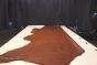 Brandy colored vintage leather cowhide laying flat on a table 