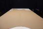 Picture of Moonlight, tan colored leather hide for upholstery displayed on a table.