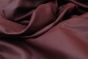 Close up picture of burgundy leather for upholstery