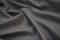 Close up picture of dark grey leather for upholstery