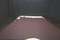 Dark purple colored leather material laying flat on a table 