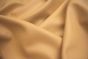 Close up picture of golden tan smooth grain leather for upholstery