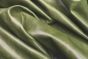Close up picture of green distressed aniline leather for upholstery